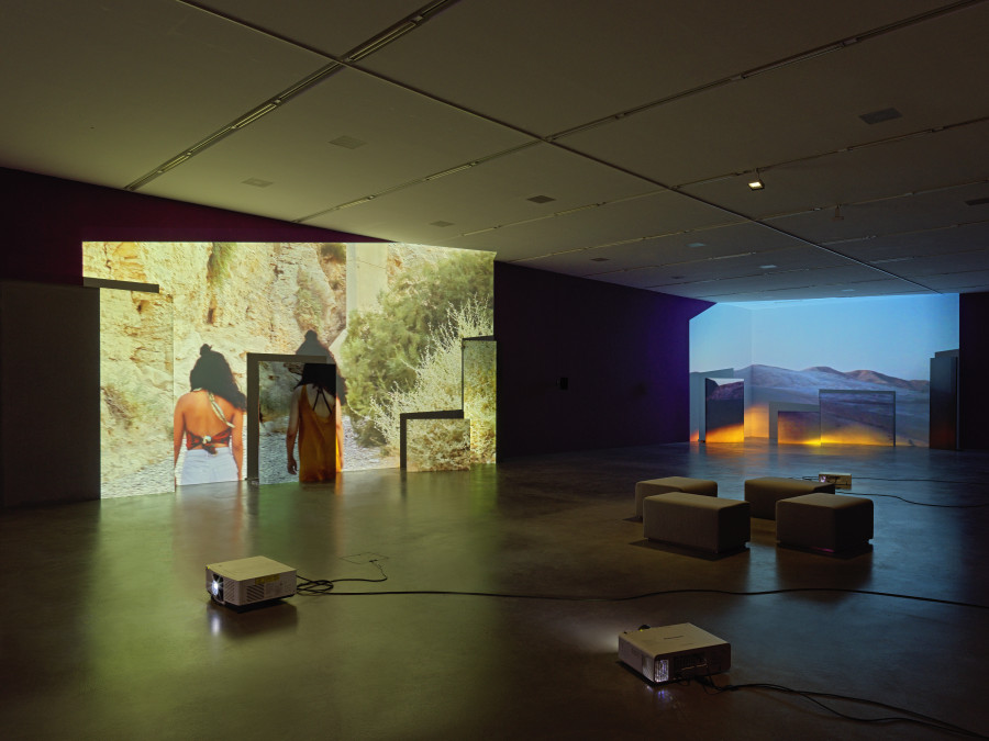 Basel Abbas & Ruanne Abou-Rhame, May amnesia never kiss us on the mouth: Only sounds that tremble through us, 2022, 4-channel video projection (HD, color, sound) on partition wall, metal and concrete panels, photographic gel. Performer: Rima Baransi, Haykal, Julmud, Makimakkuk. Courtesy the artist. Co-commissioned by the Museum of Modern Art, New York, and Dia Art Foundation, New York. Photo: Stefan Altenburger Photography, Zurich