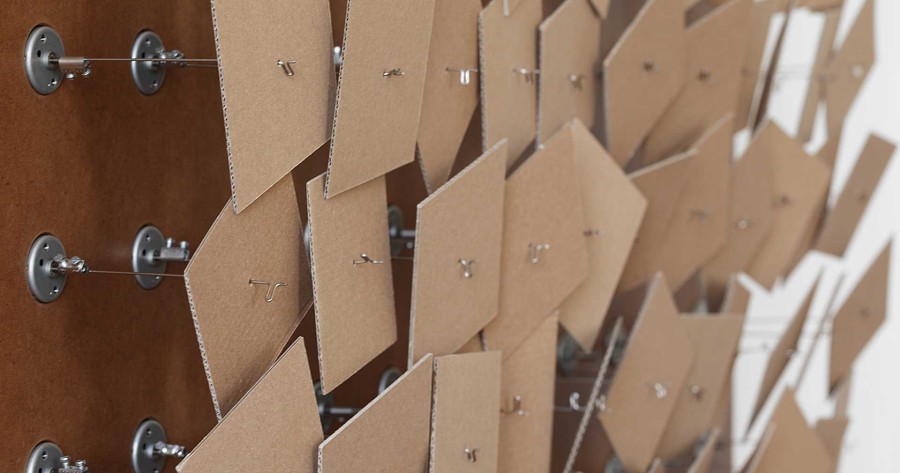 Zimoun, 121 prepared dc-motors, cardboard éléments 8x8cm (detail), Installation view Art 42 Basel, Galerie Denise René Paris, 2011. Photo: Zimoun