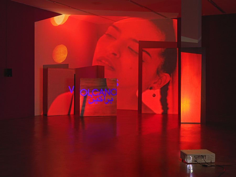 Basel Abbas & Ruanne Abou-Rhame, May amnesia never kiss us on the mouth: Only sounds that tremble through us, 2022, 4-channel video projection (HD, color, sound) on partition wall, metal and concrete panels, photographic gel. Performer: Rima Baransi, Haykal, Julmud, Makimakkuk. Courtesy the artist. Co-commissioned by the Museum of Modern Art, New York, and Dia Art Foundation, New York. Photo: Stefan Altenburger Photography, Zurich