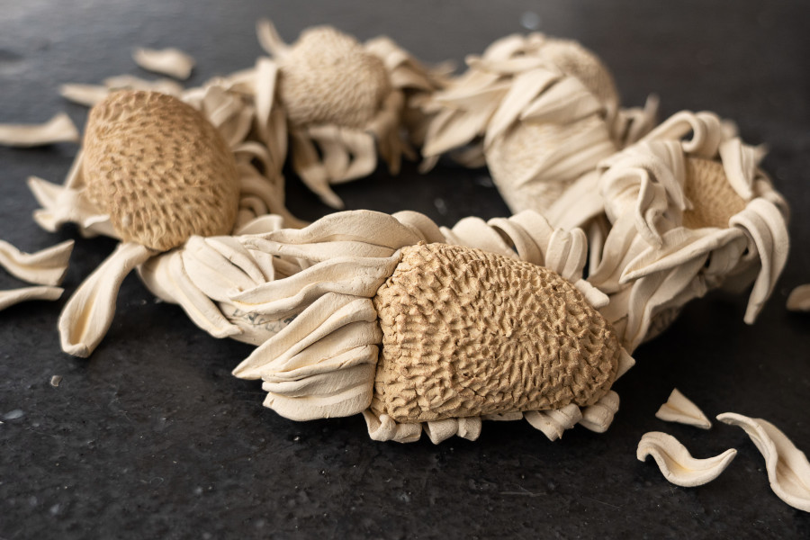 Ayla Dymterko, Vestige Vinok II, with sunflowers (detail), 2022. Stoneware ceramic with charcoal glaze. 7 x 28 x 30 cm. Unique. Photographer: Marcel Scheible. Courtesy of the artist and VITRINE London/Basel