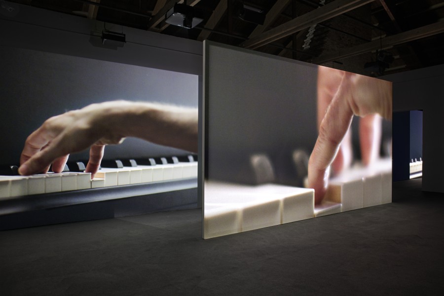 Anri Sala, AS YOU GO, 2019, 13-channel HD video and 22-channel discrete sound installation, color, 39:24 min. Installation view, Castello di Rivoli, 2019, Photo: Antonio Maniscalco, Courtesy of the artist © Anri Sala