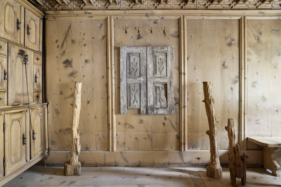 Exhibition view, Augustas Serapinas, Part of the House from Skirgiškės, 2022, reclaimed wood, 129.5 x 25 x 20 cm, Shutters from a Unknown House, 2022, reclaimed wood 102 x 85 x 3.5 cm, Part of the House from Skirgiškės, 2022, reclaimed wood, 129 x 18 x 20 cm, Part of the House from Skirgiškės, 2022, reclaimed wood, 82 x 20 x 18 cm. Photo: Ralph Feiner, Courtesy of the artist and Galerie Tschudi