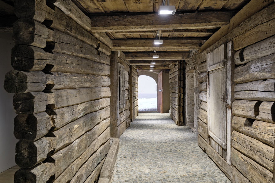 Exhibition view, Augustas Serapinas, House Wall from Didžioji Kuosinė, 2022, reclaimed wood. Photo: Ralph Feiner, Courtesy of the artist and Galerie Tschudi