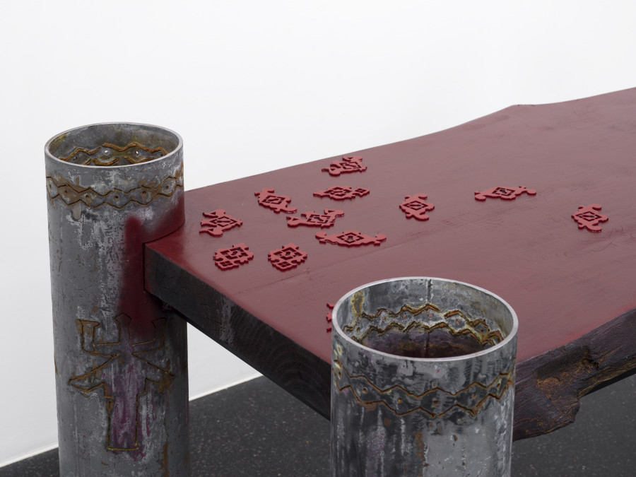 Dozie Kanu, aro pillars chukwu dinners (detail), 2022, Found steel pipes, burnt pine wood, spray paint, powder-coated steel keyhole plates, 45 x 65 x 76 cm