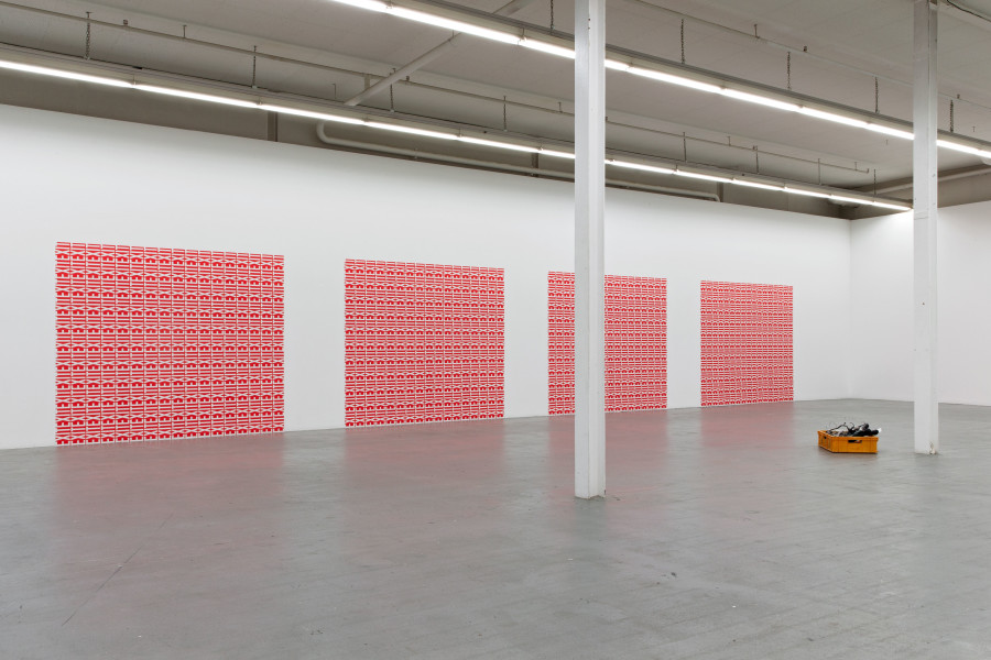 Matthias Liechti, Holes, Blanks, Ways Out (garage doors), 2020, pasted offset prints. installation dimensions variable; Mitchell Anderson, Gratis crate piece, 2020, Fly-tip situation, Zelgstrasse, Zürich, 35 x 60 x 40 cm. Ausstellungsansicht / Installation view Kunsthaus Baselland 2020. Foto / Photo: Gina Folly